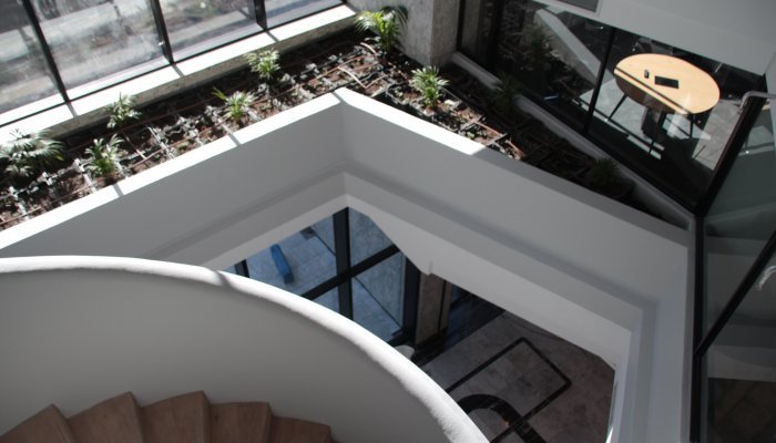 Mirroring the stone façade of the building, The Citadel’s interior features marbles, warm metals and green touches, while harvesting natural light.  